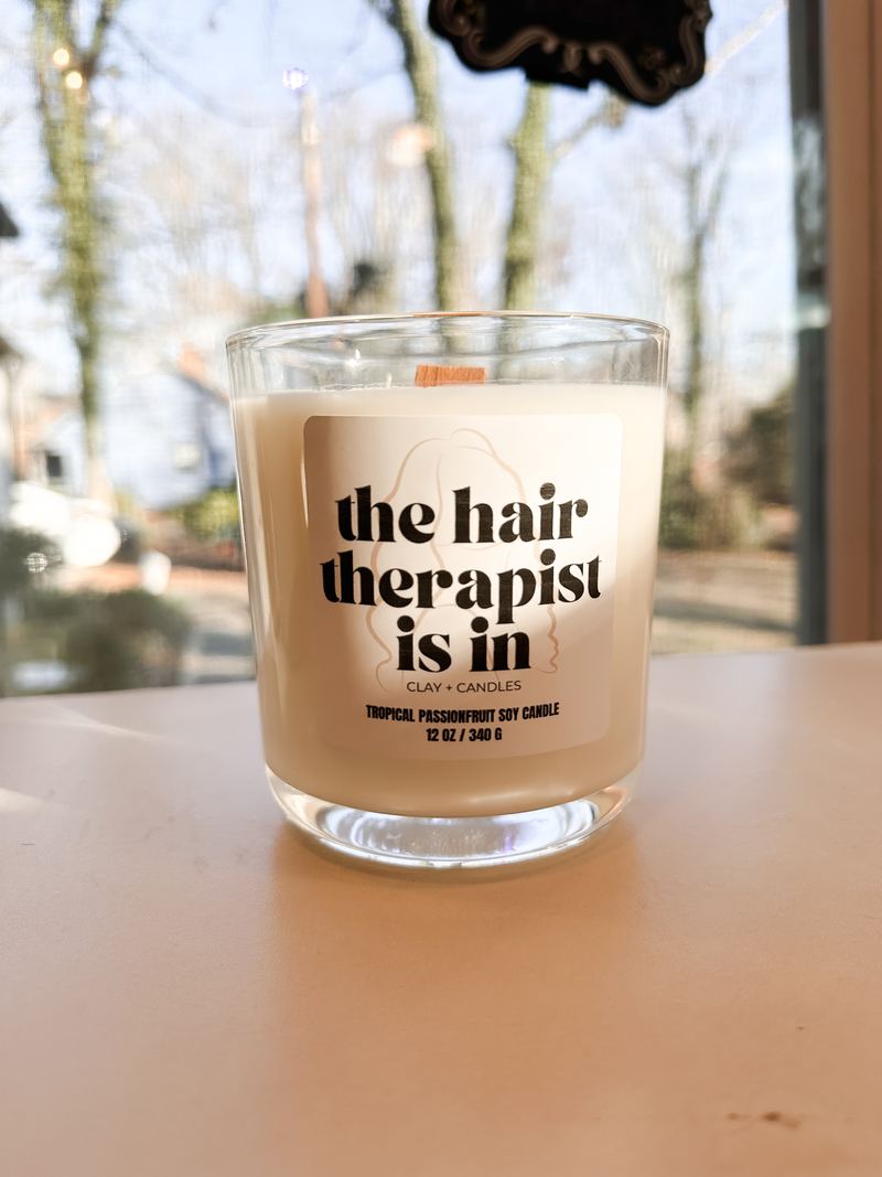 Custom glass candle labeled The Hair Therapist Is In