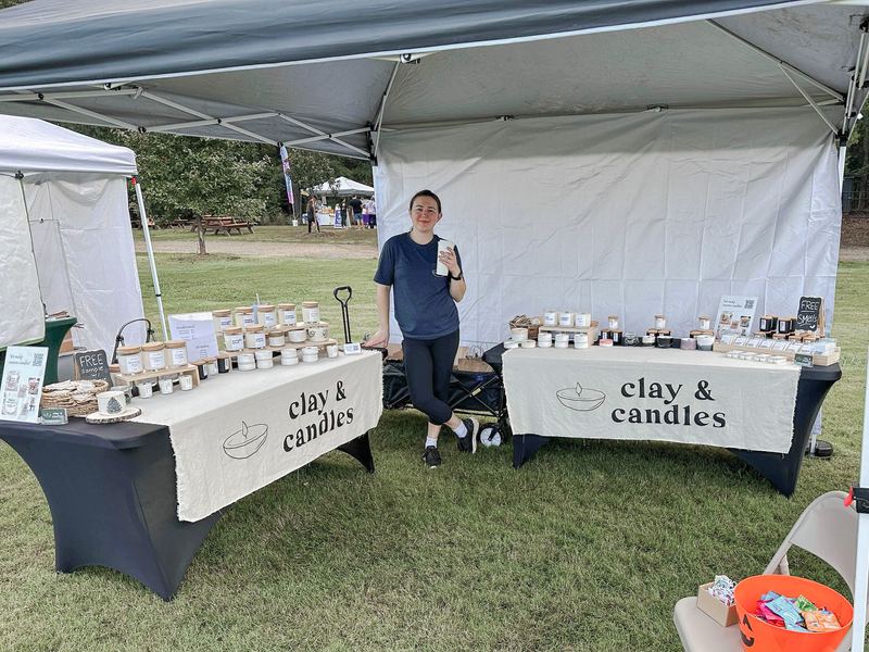 The Clay and Candles booth at an outdoor market